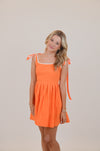 Orange Dress with Bows and White Trim