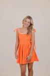 Orange Dress with Bows and White Trim