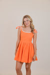 Orange Dress with Bows and White Trim