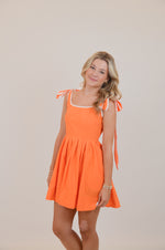 Orange Dress with Bows and White Trim