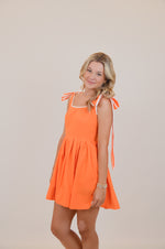 Orange Dress with Bows and White Trim