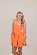 Orange Dress with Bows and White Trim