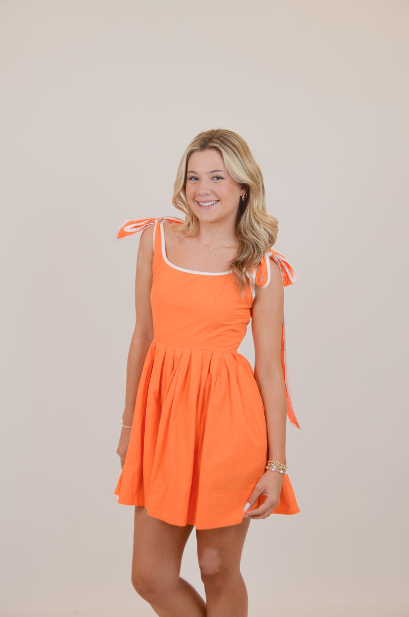 Orange Dress with Bows and White Trim